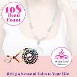 A 108-bead mixed stone mala necklace with earthy brown black blue cream beads and a clear crystal tree of life pendant