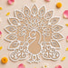 White laser-cut peacock 12 inch diy mdf reusable rangoli mat with intricate feather patterns and beige inner layer