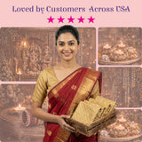 Woman in red gold saree holding wooden tray with golden brocade fabric