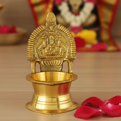 Golden brass Kamakshi Deepam oil lamp with deity carving