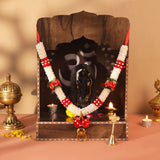 Dark wooden altar with Om symbol, black deity statue in 12-inch idol mala garlands