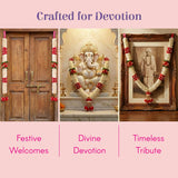 White marble Ganesha statue with gold details and floral garland