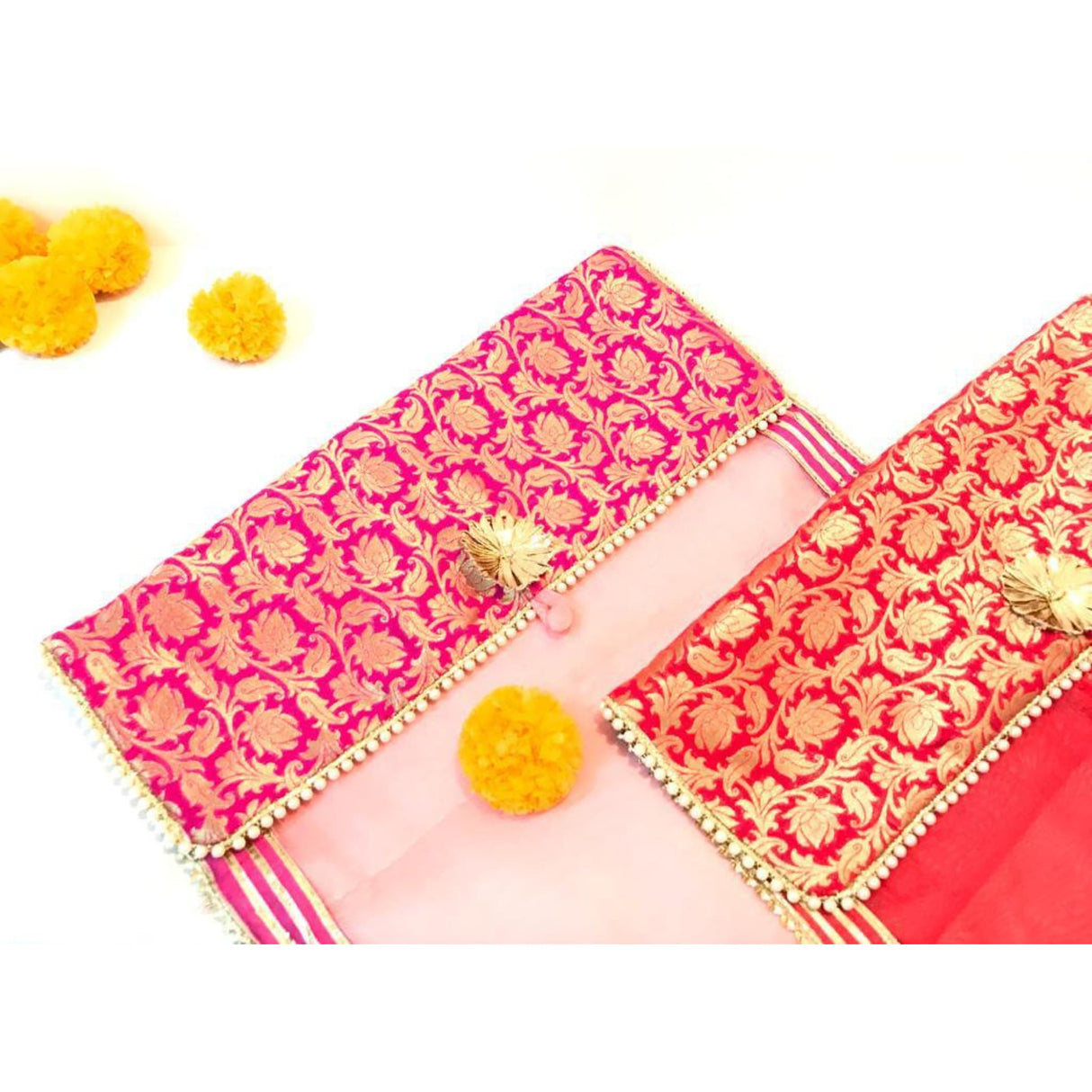 Pink and orange brocade clutch with gold accents for saree storage and gifting