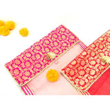 Pink and orange brocade clutch with gold accents for saree storage and gifting