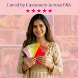 Woman holding colorful paisley shagun money envelopes in pink, green, yellow, red