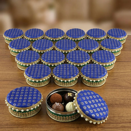 Blue patterned fabric-lidded steel ladoo box with gold and green trim perfect for holi diwali sweets gifts