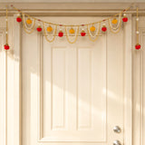 Bead door toran with golden string red and yellow pom-poms white beads and tassels for festive decorations