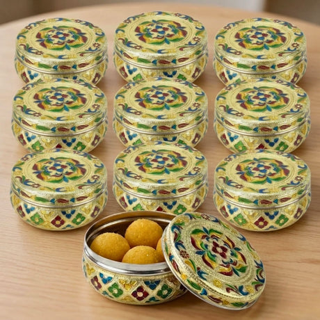 Golden Meenakari enamel floral stainless steel round laddu storage tin