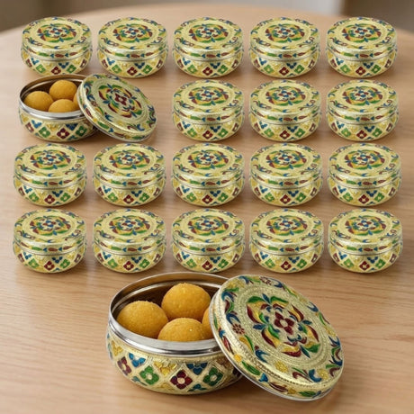 Yellow green Meenakari laddu tins with floral designs and golden sweets