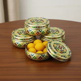 Golden floral tin with lid and decorative design for sweet and spice storage