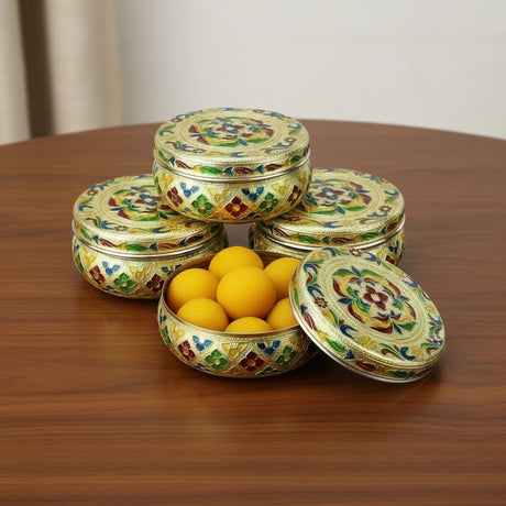Golden floral tin with lid and decorative design for sweet and spice storage