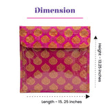 A vibrant pink and gold brocade sari bag with zipper closure and clear plastic front panel for clothes storage and gifting
