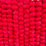 Bright red pom-pom garlands for Ugadi decoration in Indian decor arrangements