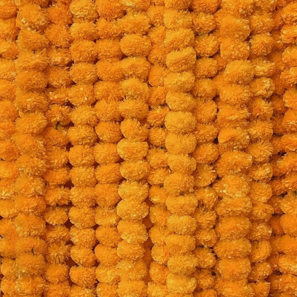 Vibrant orange artificial marigold garland strands for Ugadi and Indian festival decorations