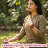 Warm terracotta Rudraksha bracelet on woman’s wrist