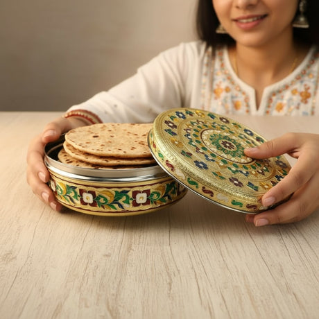 Ornate round stainless steel container with lid holding flatbreads for storage