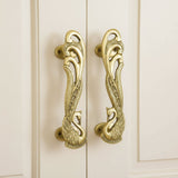 Pair of 7-inch ornate brass peacock cabinet handles with feather details