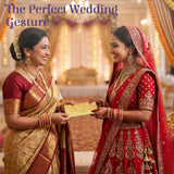 Gold-colored, ornate wedding gift envelope with intricate embossed patterns.