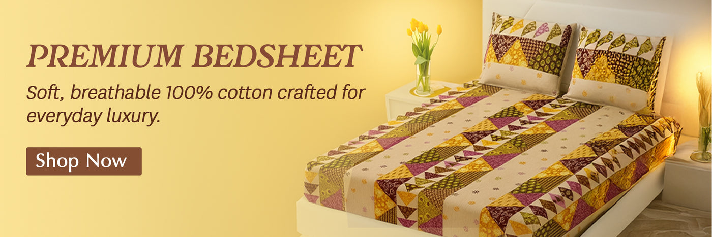 Indian block-printed patterned bedspread on a bed with a yellow wall and 'Shop Now' button