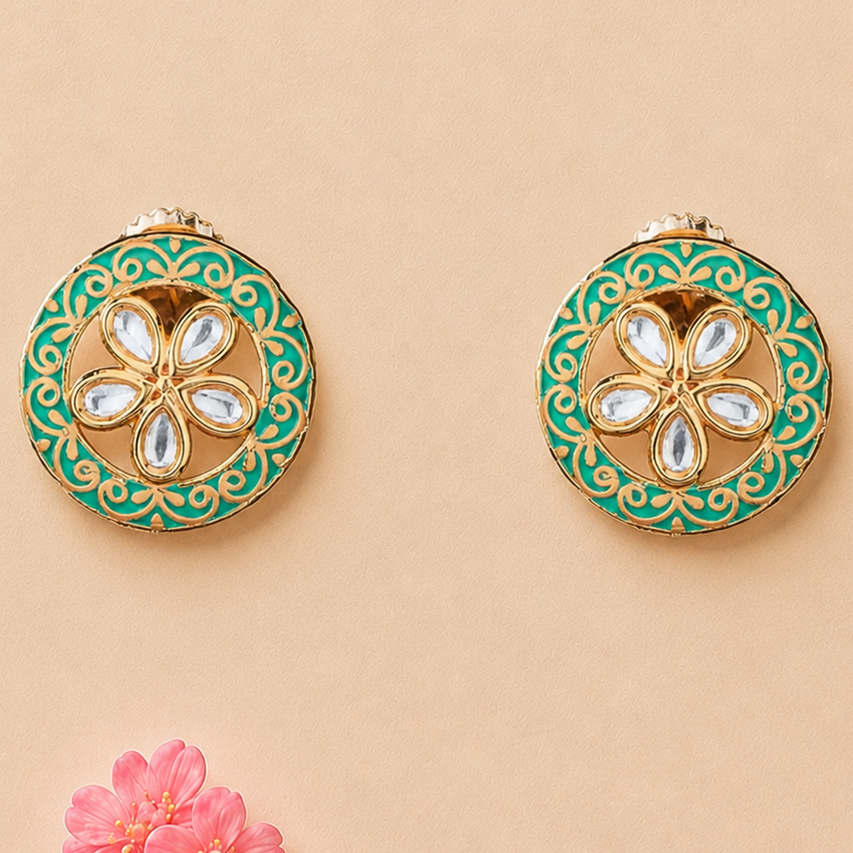 Indian kundan stud earrings in teal and gold enamel with five-petal flower design and clear stone accents
