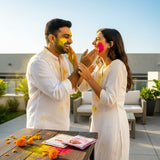 Vibrant yellow pink Holi powder packet with marigolds, 75g pack for festivals