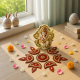 A detailed cream-colored ganesha figurine with gold accents and leafy halo alongside a 6.5 inch acrylic diya floor rangoli for diwali decor