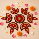 Red and gold decorative rangoli designs in symmetrical pattern acrylic diya floor rangoli for diwali and home decor