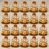 Set of fifteen ornate acrylic Ganesha idols with cream bodies and gold teal accents for home temple and festival decor