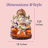 Colorful 2.25-inch acrylic Ganesha statue with white body, gold accents, orange robes