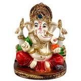 2.25 inch multi-colored acrylic Ganesha statue with white face, red pants, gold jewelry