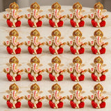 Red and gold acrylic ganesha idol with intricate detailing for home temple car dashboard and festival decor