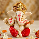 A glossy white and red acrylic car ganesha statue idol with gold accents for home decoration and car dashboard use