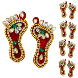 Acrylic lakshmi charan paduka feet pair in red with gold beads and green rhinestones for diwali door decoration