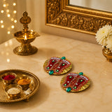 Red and gold acrylic lakshmi charan paduka coasters with green gemstones and white beads for diwali home temple decor