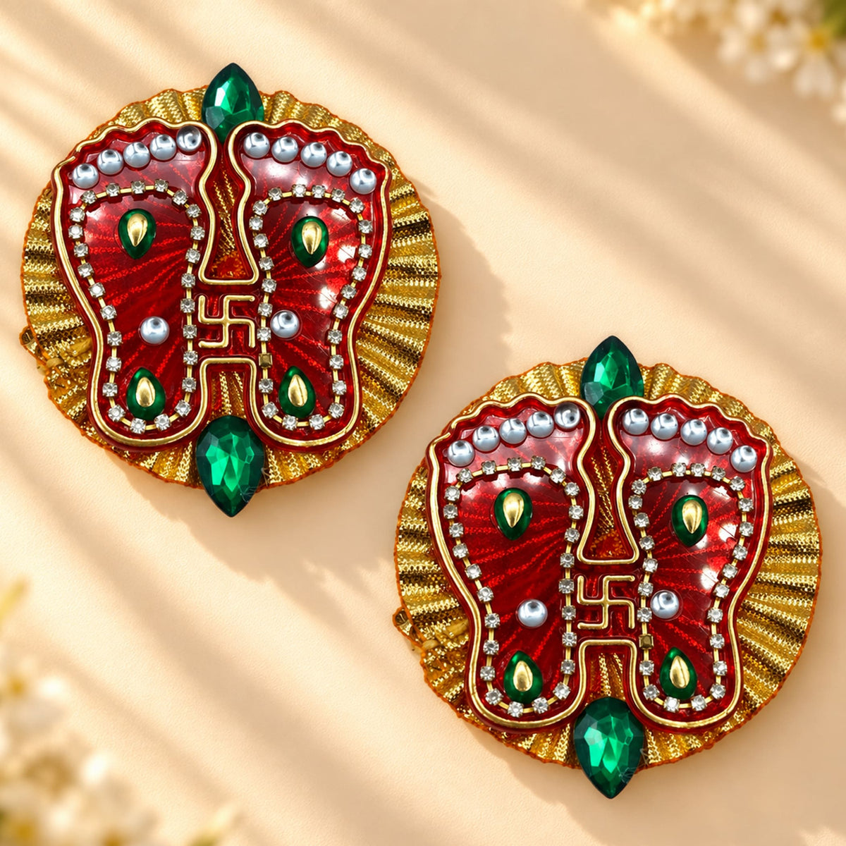 Acrylic lakshmi charan paduka feet in red and gold with green gems silver beads and clear rhinestones for diwali decor