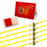 Yellow bee-themed handmade rakhi bracelets with black and yellow plastic bodies orange beads and yellow ribbon for brother