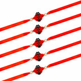 Red satin ribbon animal theme rakhi with black and red ladybug charm and two small pearls for protection and good luck