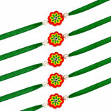 Five green fabric animal theme rakhis with red and yellow flower charms and white pearl beads for brother gift