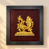 Golden ornate peacock sculpture in brass mounted on dark wood panel within black frame annam wall hanging artwork