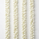 Four artificial jasmine garlands with delicate white buds for festivals