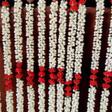 Elegant white and red artificial jasmine buds and rose garland with delicate blossoms for traditional Indian decor and ceremonies
