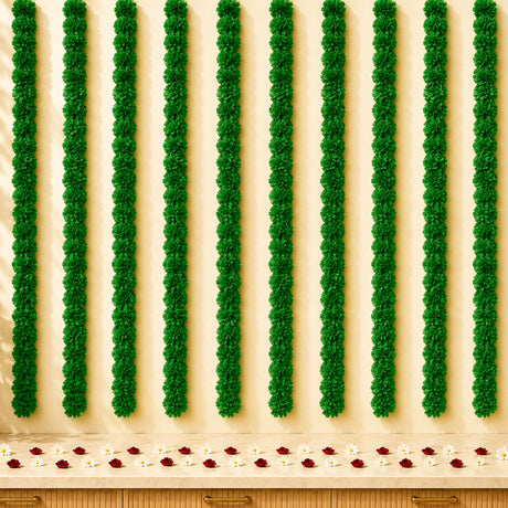 Artificial marigold strings with green floral garlands and red white petals for diwali and day of the dead decor