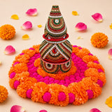 A vibrant beaded conical vessel with red green and gold patterns for Ugadi decor flower rangoli and festive use