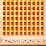 Artificial marigold mango leaf strings with vibrant orange and yellow pom-pom flowers for diwali and indian wedding decor