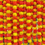 Artificial marigold strings with red and yellow pom-pom garland and circular cutout for festive decor