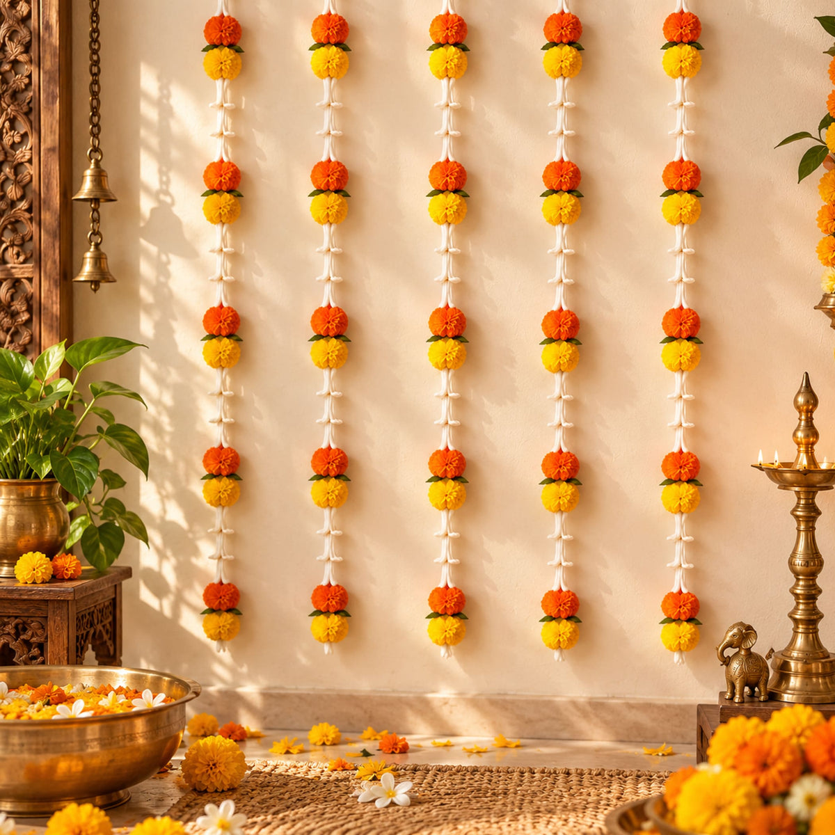 Artificial orange and yellow marigold and tuberose flower garlands hanging vertically for wedding and festive decor