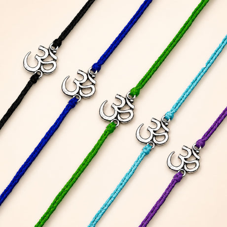 Silver om symbol charms on colorful braided cords in om rakhi for brother spiritual thread for protection and good luck