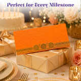 Orange money envelope with intricate gold embossed wheel pattern along bottom edge for indian wedding and gifts