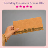 Brown textured paper money envelope with intricate gold foil detailing for indian wedding cash gifts and savings
