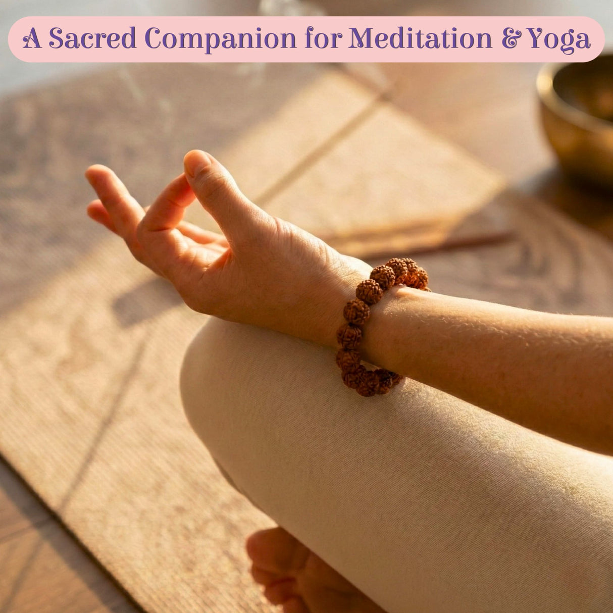 Brown 5 Mukhi Rudraksha bracelet on hand in meditative pose